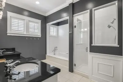 a bathroom with a sink and a shower at Bungalow 8 in Watersound Beach