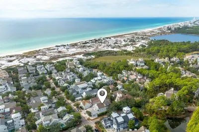 an aerial view of a residential neighborhood with a white circle at Bungalow 8 in Watersound Beach