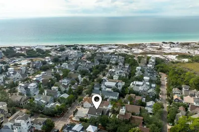 an aerial view of a town with a white circle on top at Bungalow 8 in Watersound Beach