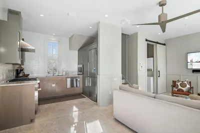 a large kitchen with a couch in a room at 34 S Briland Lane Carriage House in Rosemary Beach