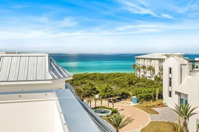 a view of the ocean from the balcony of a building at 30A Showhouse in Rosemary Beach