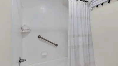 a bathroom with a shower with a shower curtain at Eastern Shores 103 in Santa Rosa Beach
