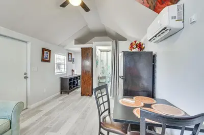 a kitchen and dining room with a table and chairs at Lakefront Panama City Studio with Hot Tub Access in Panama City