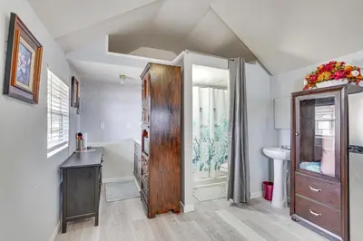 a bathroom with a tub and a sink and a shower at Lakefront Panama City Studio with Hot Tub Access in Panama City