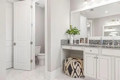 a white bathroom with a sink and a toilet at Nature and the Beach in Santa Rosa Beach