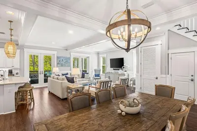 a dining room and living room with a dining table at Nature and the Beach in Santa Rosa Beach