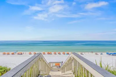 a view of a beach with umbrellas and the ocean at Blue Tide 6B in Inlet Beach