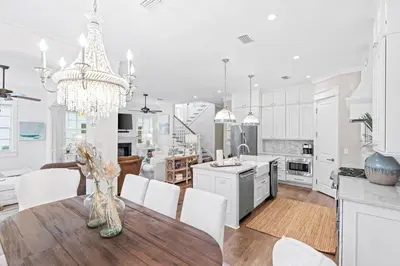 a kitchen and dining room with a table and chairs at A Shore Bet in Santa Rosa Beach