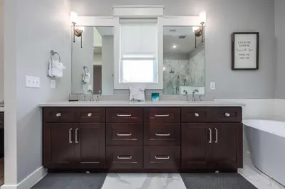 a bathroom with two sinks and a large mirror at Mai Tide in Inlet Beach