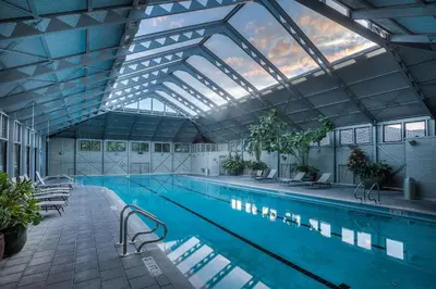a large swimming pool with a large glass ceiling at 34 South Briland Main House in Rosemary Beach