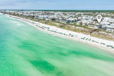 an aerial view of a beach with houses and the ocean at 34 South Briland Main House in Rosemary Beach