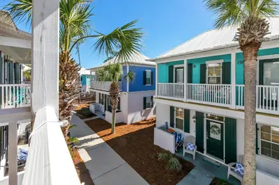 an aerial view of a house with palm trees at Seagrove Bungalow 110 - One Ten Again in Santa Rosa Beach