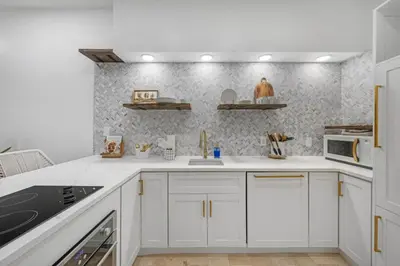 a kitchen with white cabinets and a wall at 30A Villages of South Walton B190 - Free Bicycles in Seacrest