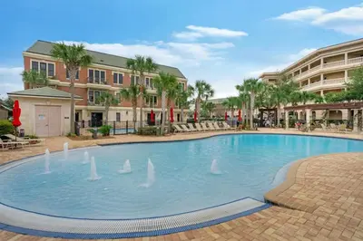a large swimming pool with swans in the water at 30A Villages of South Walton B190 - Free Bicycles in Seacrest