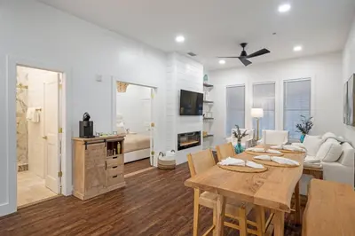a living room with a table and a couch at 30A Villages of South Walton B190 - Free Bicycles in Seacrest
