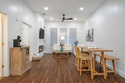 a dining room and living room with a table and chairs at 30A Villages of South Walton B190 - Free Bicycles in Seacrest