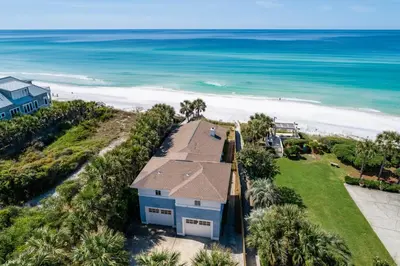 an aerial view of a house and the beach at Sea Turtle Cottage in Santa Rosa Beach
