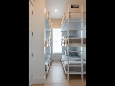 a room with bunk beds in a room at Ocho Cinco in Santa Rosa Beach