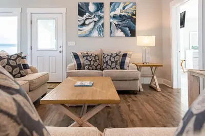 a living room with a couch and a coffee table at 50 Sea Turtle in Santa Rosa Beach