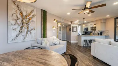 a living room with a couch and a table at Steps to the Beach Pool Hot Tub Renovated Retreat Sea Haven by AvantStay in Santa Rosa Beach