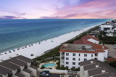 an aerial view of a beach and buildings and the ocean at Grand Playa Unit 402 Gulf Front Condo in Santa Rosa Beach