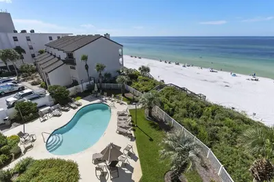 an overhead view of a pool and the beach at Grand Playa Unit 402 Gulf Front Condo in Santa Rosa Beach