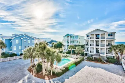an aerial view of a apartment complex with a swimming pool at Gulf Side Condo Seagrove Beach Community Pool in Santa Rosa Beach