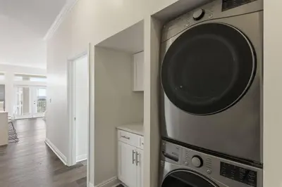 a kitchen with a washer and dryer on a wall at Gulf Side Condo Seagrove Beach Community Pool in Santa Rosa Beach