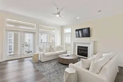 a living room with white furniture and a fireplace at Gulf Side Condo Seagrove Beach Community Pool in Santa Rosa Beach