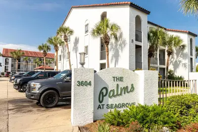 a sign for the palma at segestion apartments at Palms of Seagrove D5, Steps to the Beach, Sleeps 4, Pool, 2 bikes and 5 mins from Seaside in Seagrove Beach