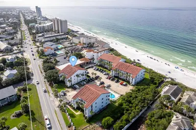 an aerial view of the beach and buildings at Palms of Seagrove D5, Steps to the Beach, Sleeps 4, Pool, 2 bikes and 5 mins from Seaside in Seagrove Beach