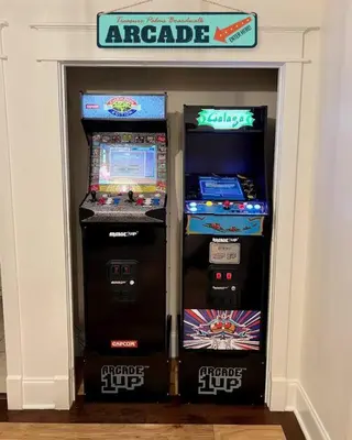 two arcade machines sitting next to each other at Treasure Palms - Golf Cart- Bikes - Arcade- Peloton- Near Rosemary - Community Pool in Rosemary Beach