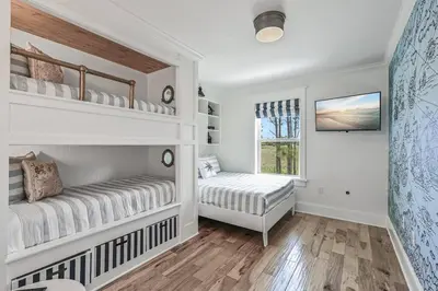 a white room with two beds and a window at Treasure Palms - Golf Cart- Bikes - Arcade- Peloton- Near Rosemary - Community Pool in Rosemary Beach