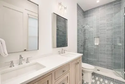 a white bathroom with a sink and a shower at Costa Fortune in Inlet Beach