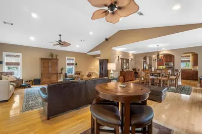 a living room with a table and a dining room at 30A Beach House - The Hemingway by Panhandle Getaways in Seacrest