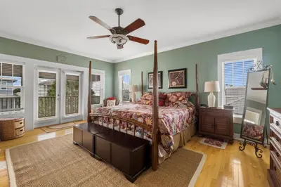 a bedroom with a bed and a ceiling fan at 30A Beach House - The Hemingway by Panhandle Getaways in Seacrest