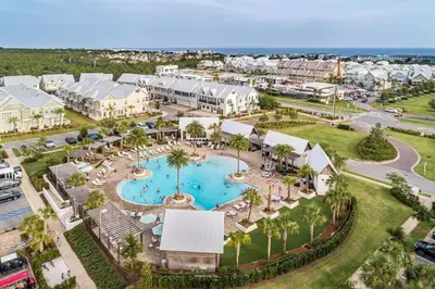 an aerial view of a resort with a swimming pool at 30A Top Rated! Heated Resort Pool+Golf Cart+Bikes+Bunks+Beach Gear in Watersound Beach