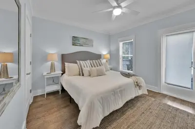 a white bedroom with a bed and a window at Anna's Beach House Walk-Out To 30A in Seacrest- Pet-Friendly in Rosemary Beach