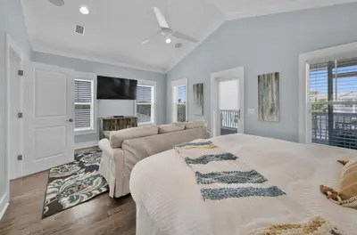 a white bedroom with a bed and a couch at Anna's Beach House Walk-Out To 30A in Seacrest- Pet-Friendly in Rosemary Beach