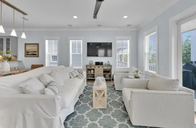a white living room with white furniture and windows at Anna's Beach House Walk-Out To 30A in Seacrest- Pet-Friendly in Rosemary Beach