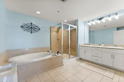 a large bathroom with a tub and a shower at Laketown Wharf #1734 by Nautical Properties in Panama City Beach