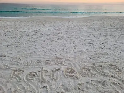a word written in the sand on a beach at Beautiful Home .5mi to Beach SLPS 14! Bikes, 3rd Floor Bunk/Game Room - 2 King Bedrooms in Inlet Beach