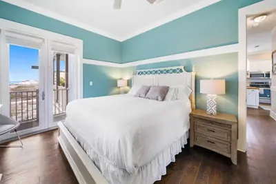 a bedroom with a bed and a window at La Luna in Santa Rosa Beach