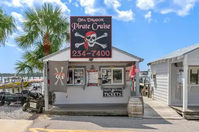 a restaurant with a sign for a pirate cruise at Sunshine House! 3BR 2BA Sleeps 9! Your perfect retreat for comfort and style in Panama City