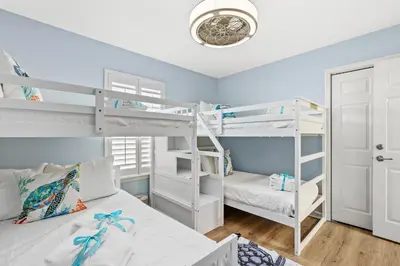 a bedroom with a bunk bed and a bunk bed at Sunshine House! 3BR 2BA Sleeps 9! Your perfect retreat for comfort and style in Panama City