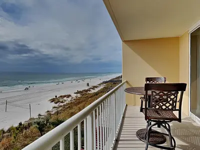 a balcony with a table and a view of the beach at Majestic Beach Towers I #312 in Panama City Beach