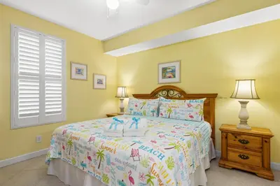 a bedroom with a bed with candles on it at Grandview Oasis! 3BR 2BA Sleeps 9! Gulf-front tranquility beckons! in Panama City Beach