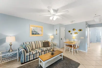 a living room with a couch and a table at Merrimac Resort #43 in Panama City Beach