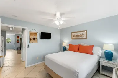 a bedroom with a bed and a ceiling fan at Merrimac Resort #43 in Panama City Beach