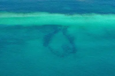 a person swimming in the water in the ocean at Just Breezin' in Santa Rosa Beach